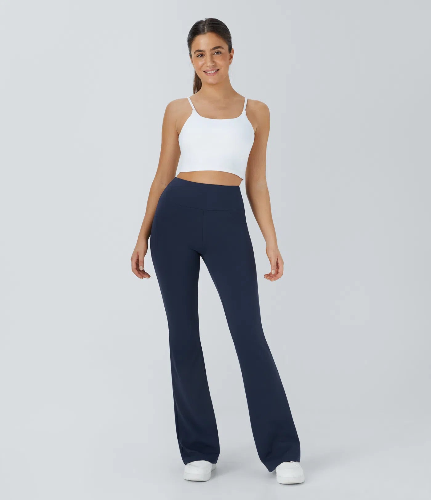 Woman wearing FEMORA high waisted flare yoga leggings
