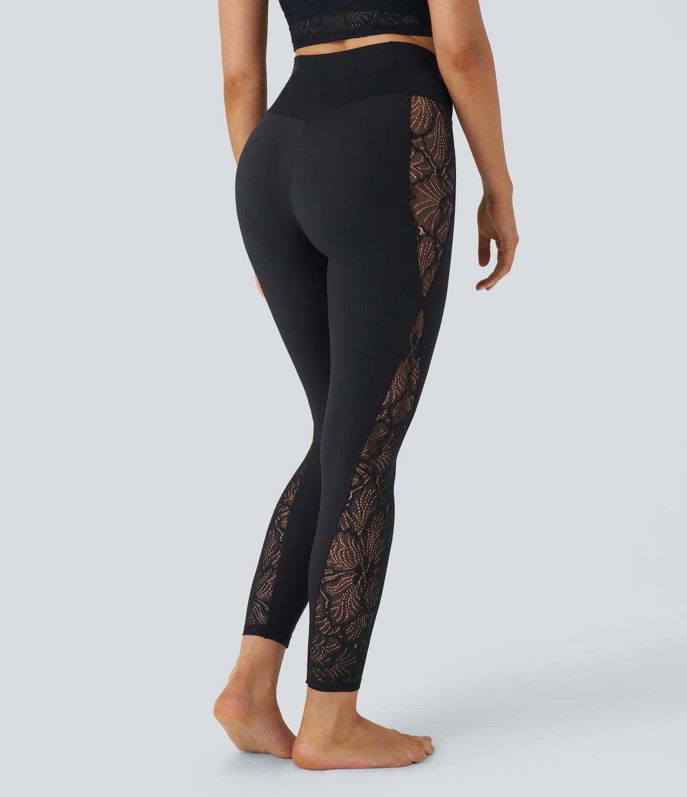 Back view of FEMORA yoga leggings with contrast lace detail
