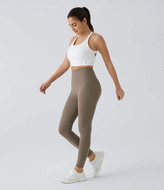 Woman wearing FEMORA UltraSculpt tummy control yoga leggings
