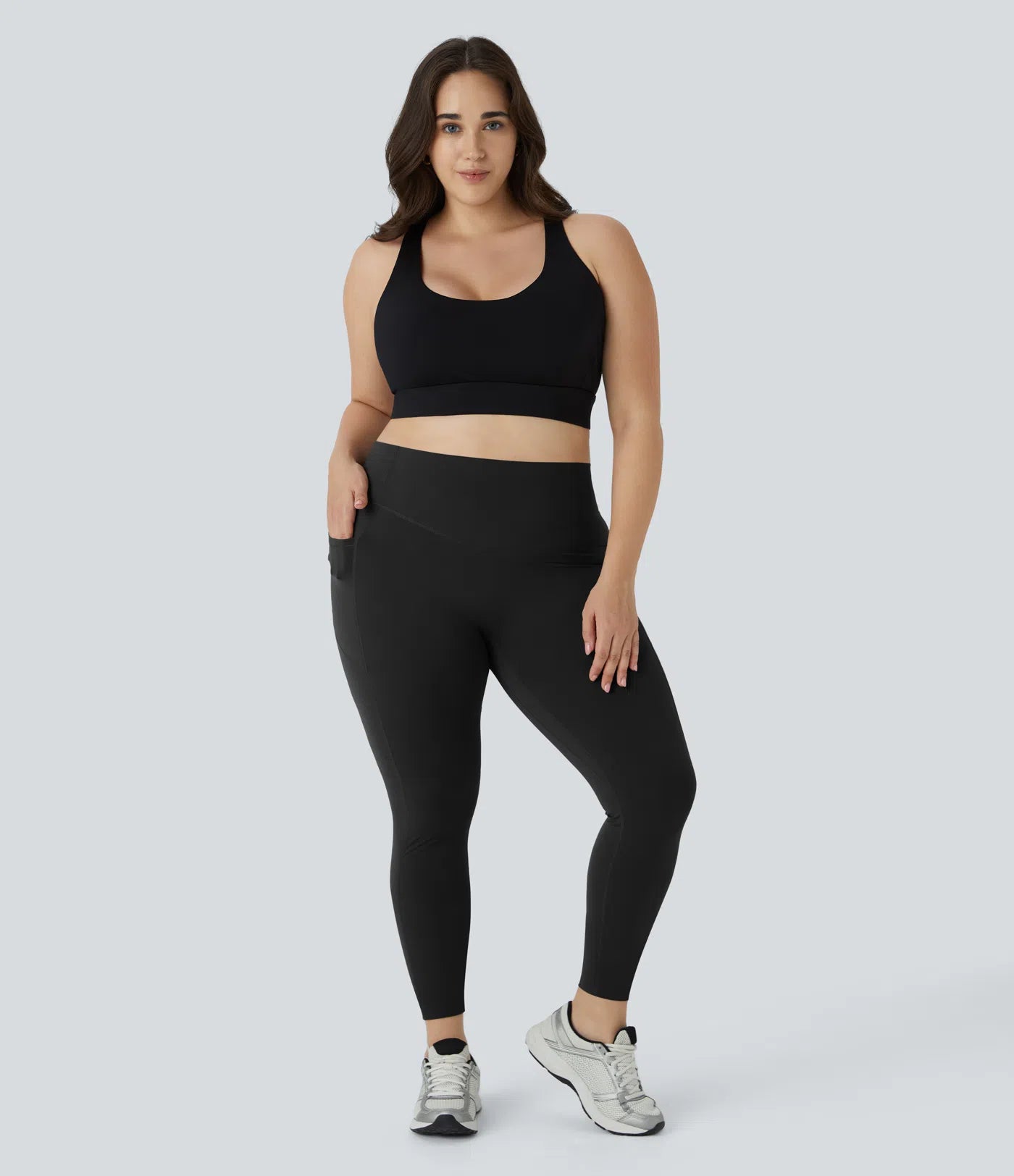 Woman wearing FEMORA high waisted scrunch butt yoga leggings
