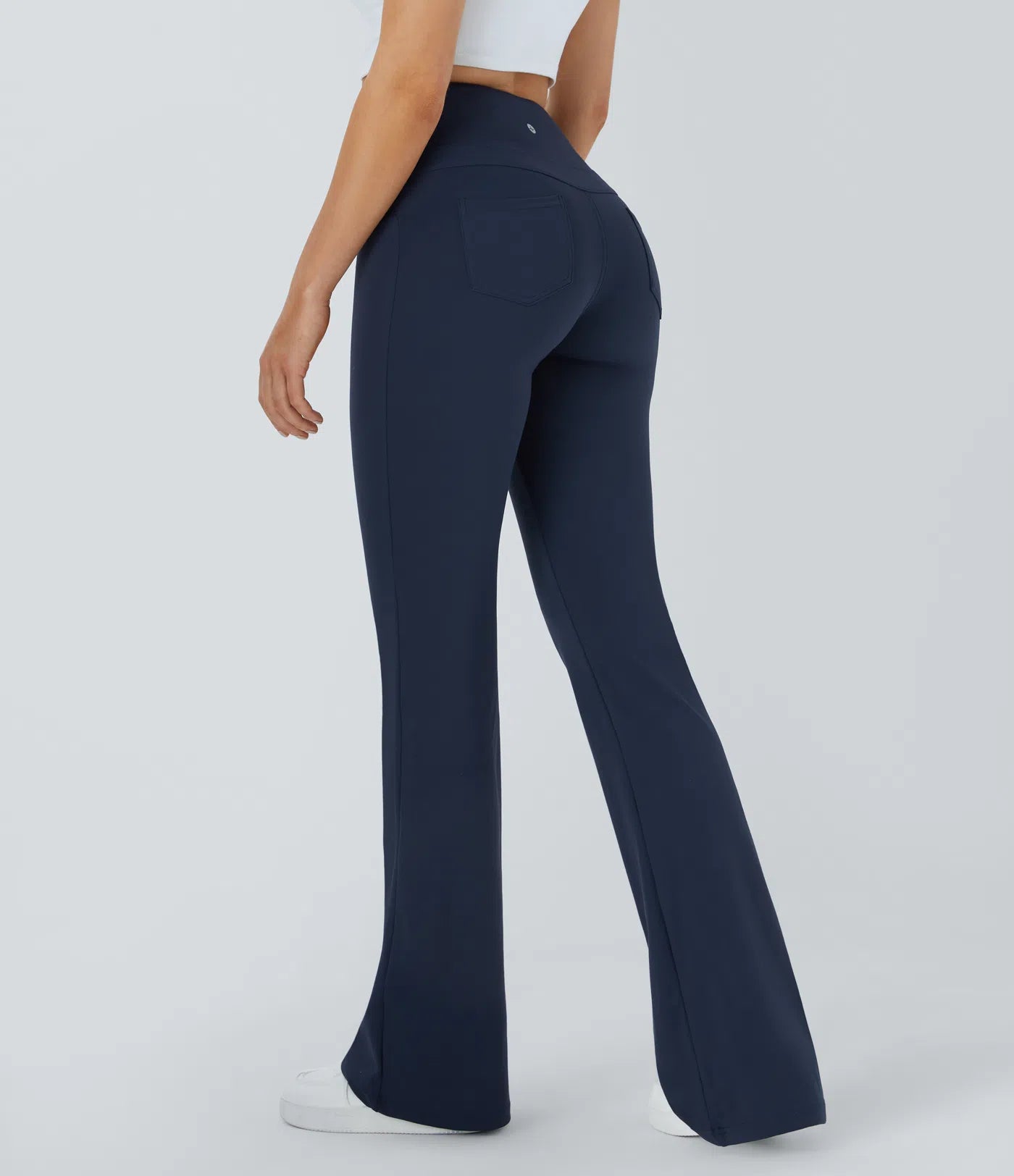 Back view of FEMORA bootcut flare leggings with pockets
