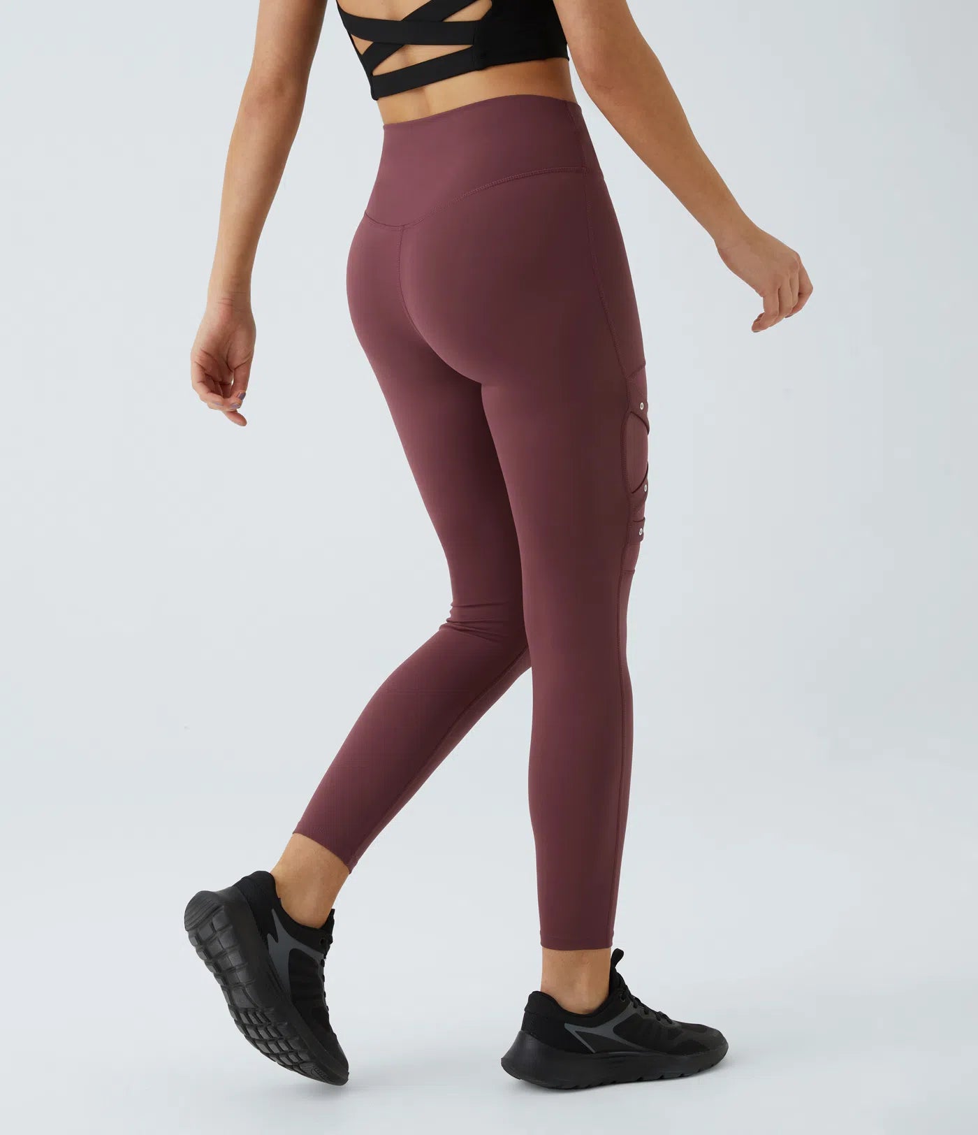Back view of FEMORA high waisted mesh panel yoga leggings
