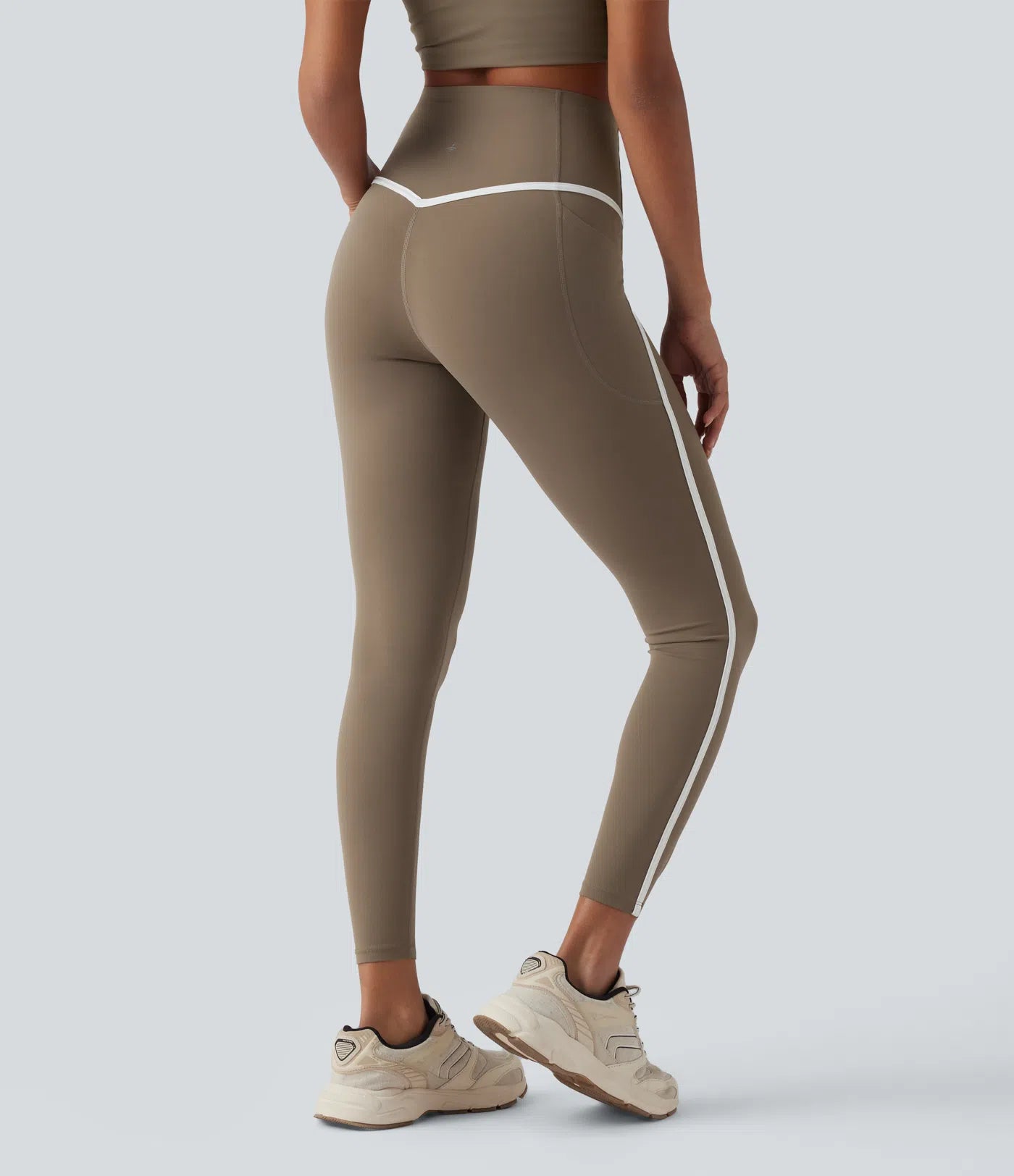 Back view of FEMORA high waisted color block leggings with pockets
