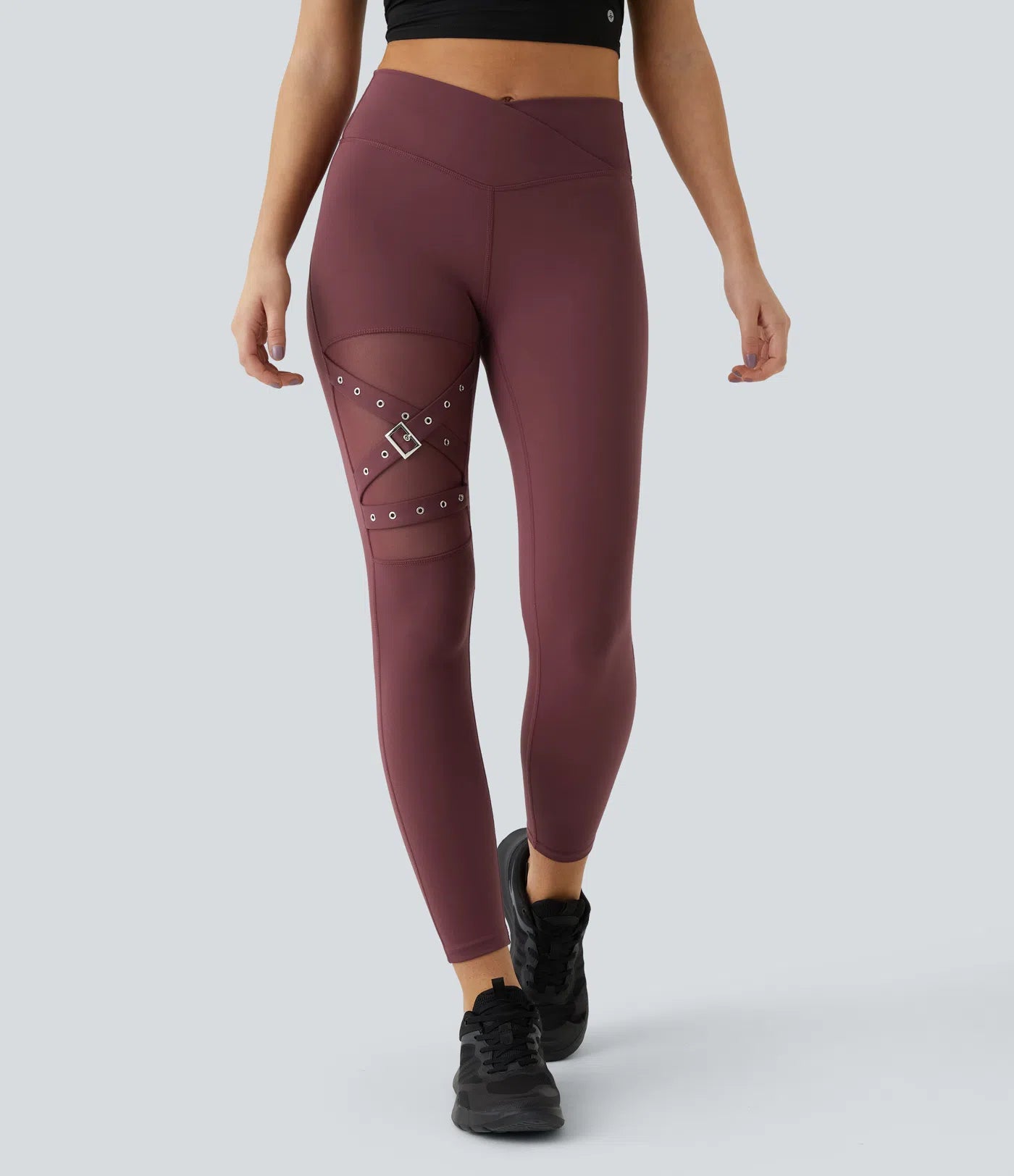 FEMORA crossover mesh yoga leggings with decorative buckle detail
