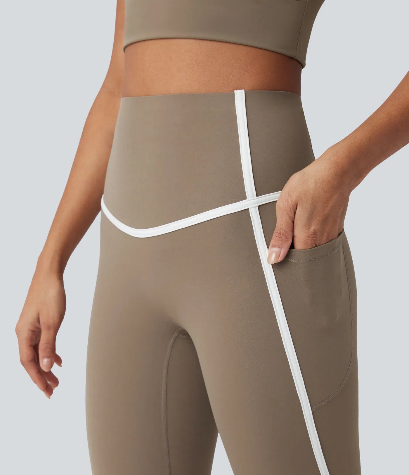 Side view of FEMORA 7/8 length color block yoga leggings
