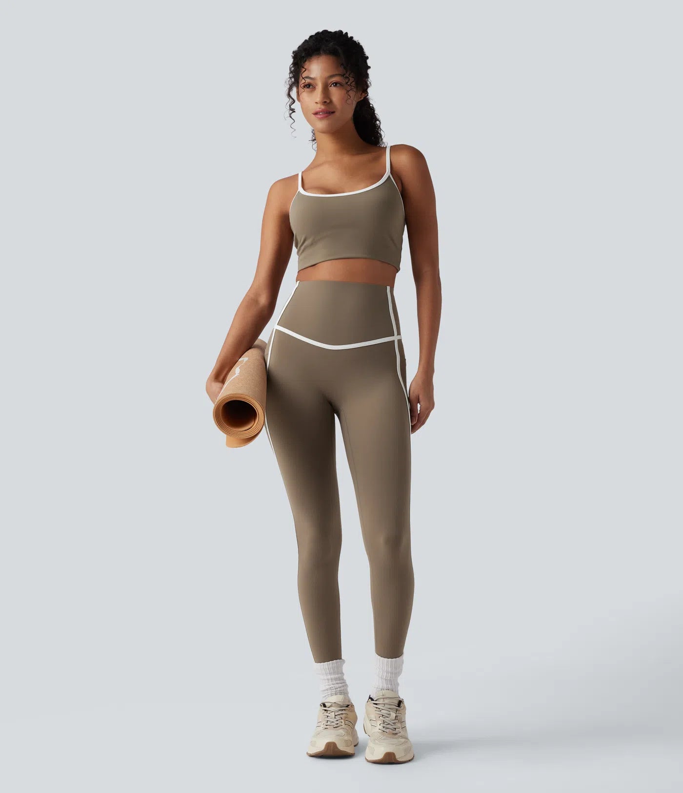 Woman wearing FEMORA color block 7/8 yoga leggings
