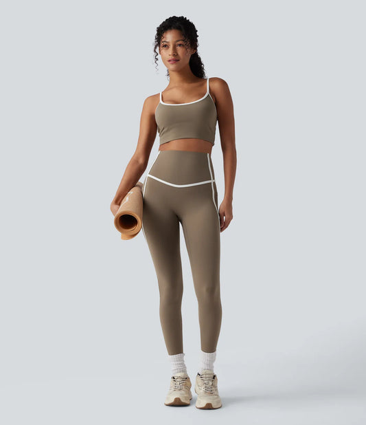 Woman wearing FEMORA color block 7/8 yoga leggings
